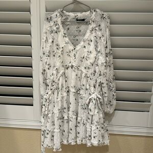 White floral dress. Ties on both sides. White slip under dress.
